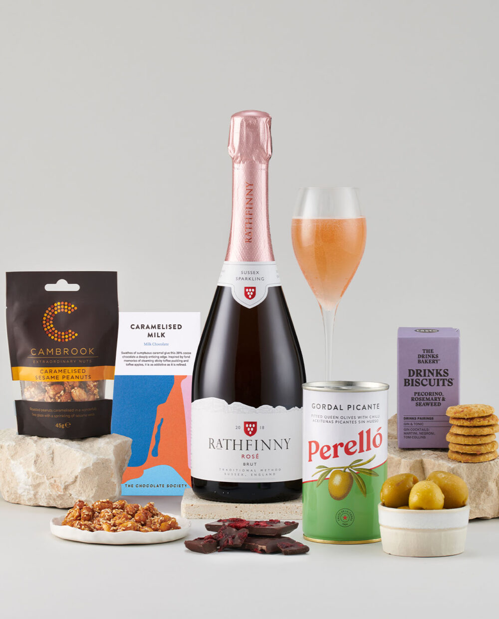 Bottle of Rose 2018 Surrounded by a Selection of Smartly Packaged Foods.