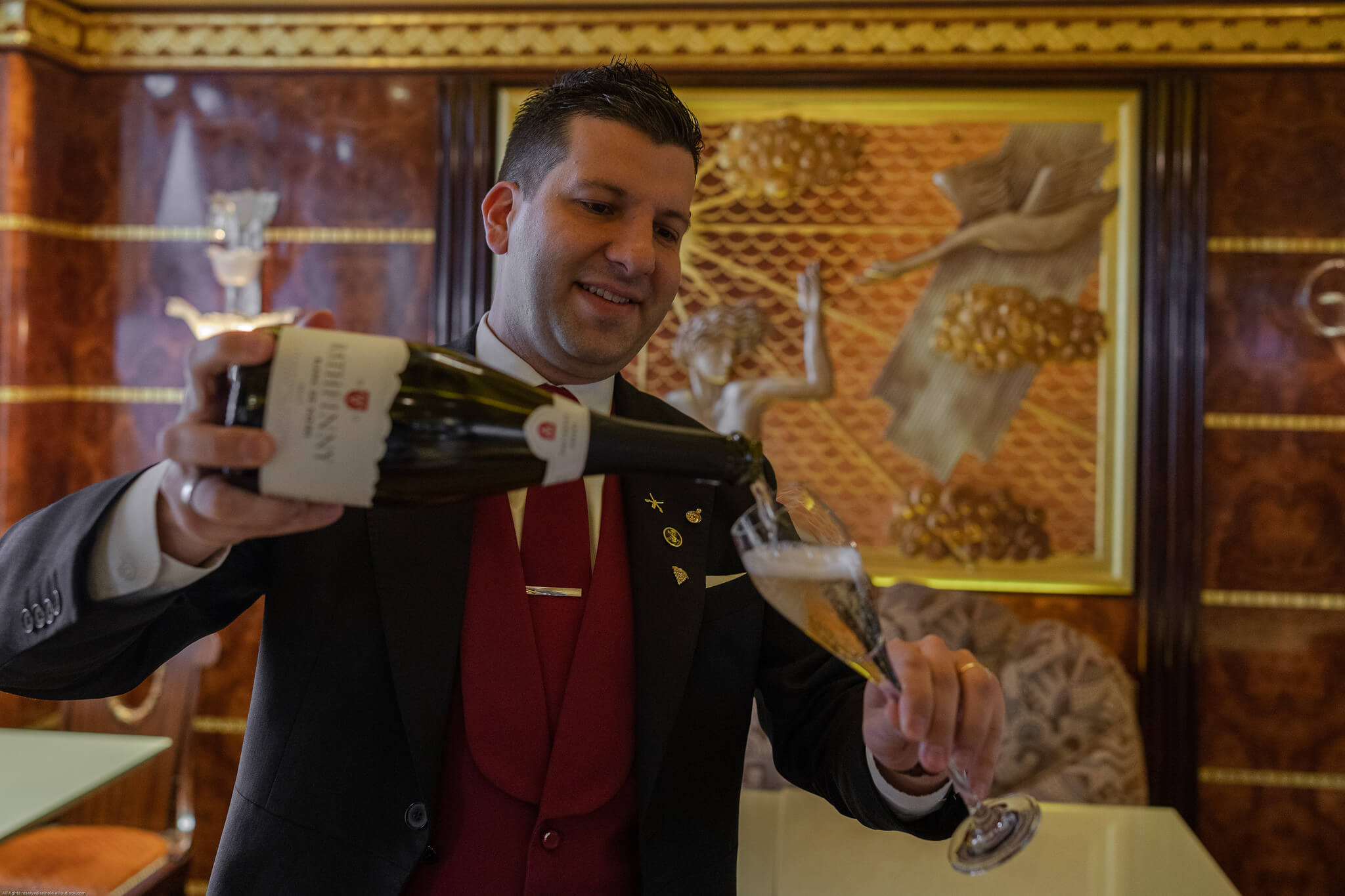 Ritz Sommelier Pouring Rathfinny