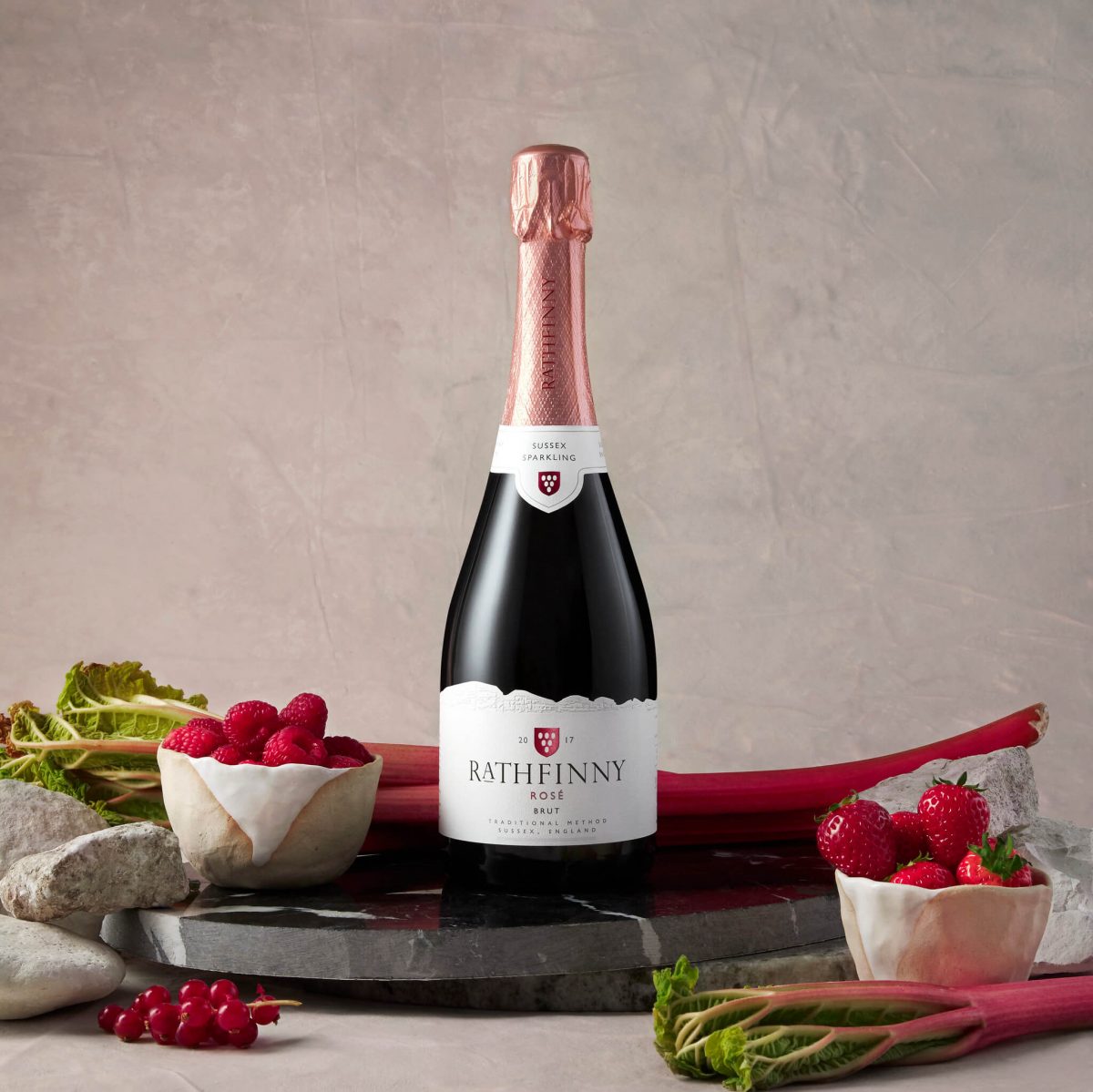 Sussex Sparkling Rose surrounded by summer fruits