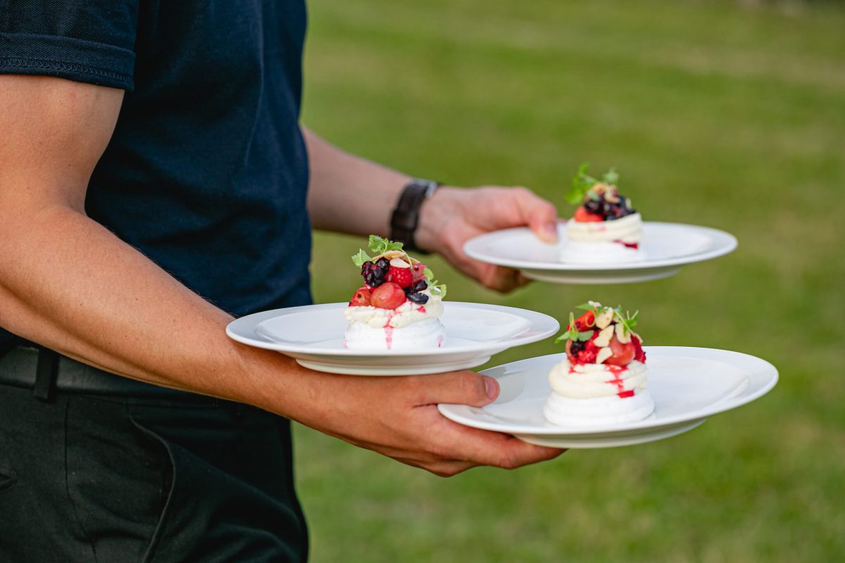 Waiter Serving Pavlova